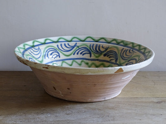 Hand-painted Mediterranean ceramic bowl with blue folkloric motifs
