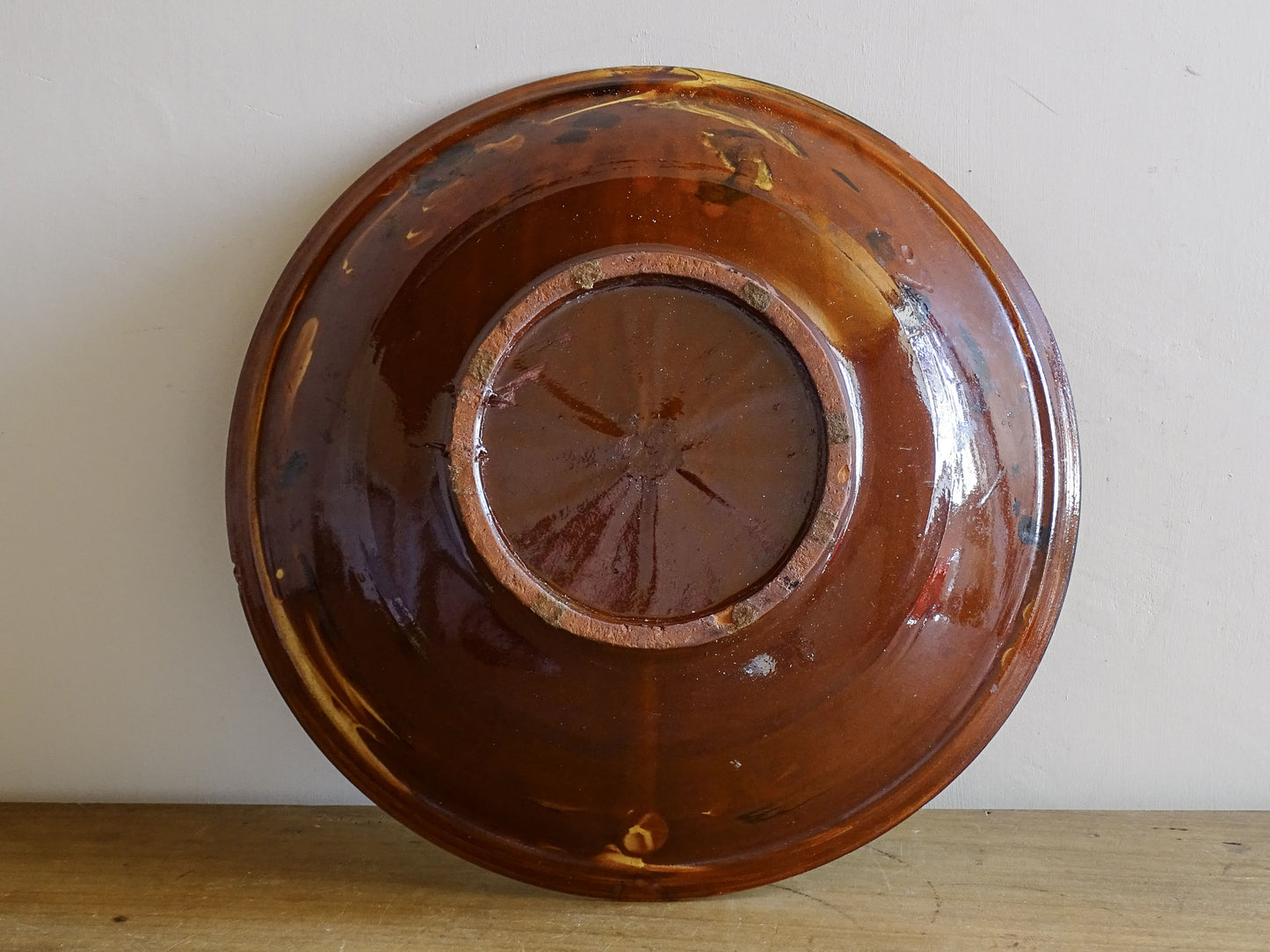 Handmade vintage earthenware serving bowl with organic glaze pattern