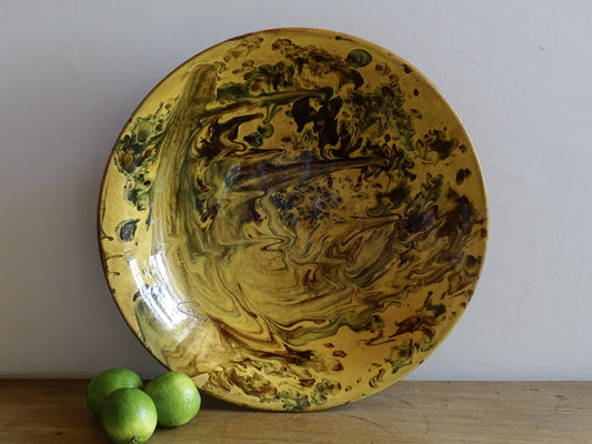 Vintage earthenware bowl with decorative marbled glaze