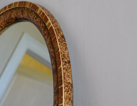 Oval French vintage wall mirror with faux burr wood and decorative tassels