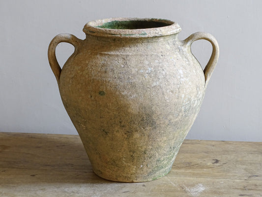 Antique French terracotta confit pot with two loop handles, rounded body and weathered green glaze