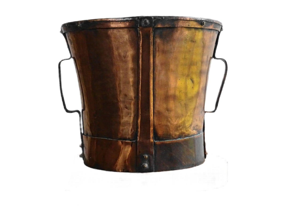 Large antique French copper pail with aged finish, originally used as a water vessel, shown on a plain white background.