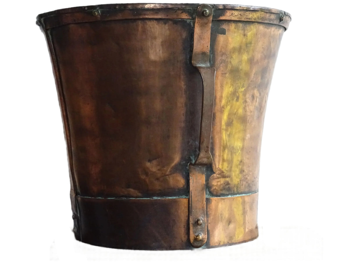 Large antique French copper pail with aged finish, originally used as a water vessel, shown on a plain white background.