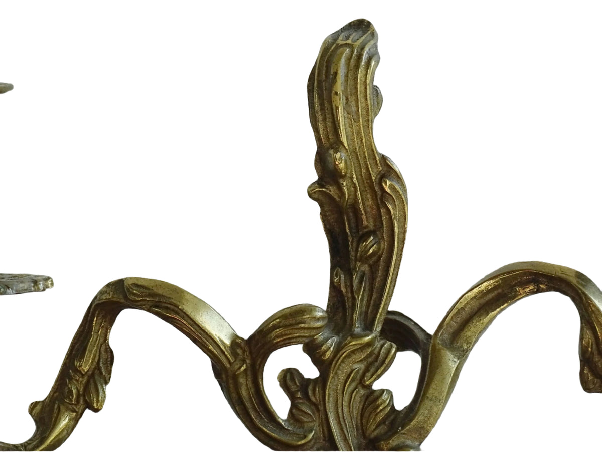 Pair of French antique brass candelabras in a rococo style. Early 20th century antique candelabras with space for two tapered candlesticks. Brass candle holders for dining table decor or living room decor.