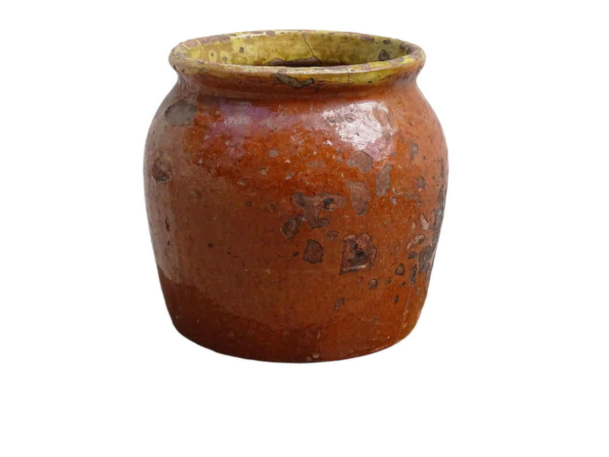 Antique French terracotta pot with brown and yellow glaze. Antique pottery pot for a rustic display.