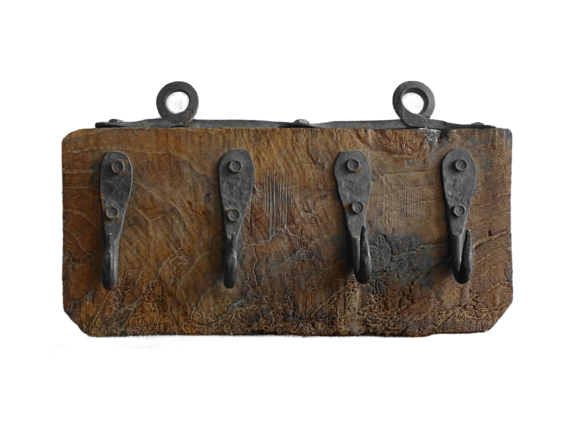 Antique Wrought Iron Hooks on Aged Wood for a French country farmhouse kitchen decor.