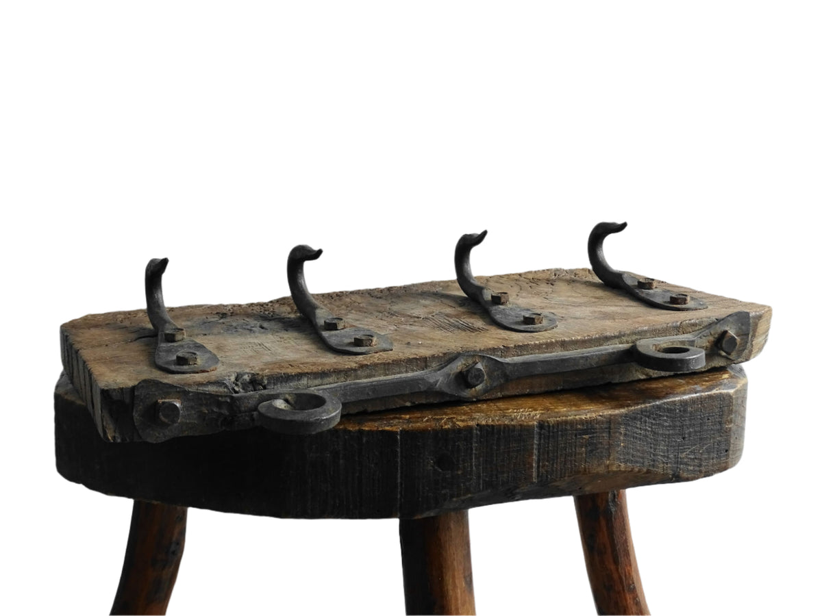 Antique Wrought Iron Hooks on Aged Wood for a French country farmhouse kitchen decor.