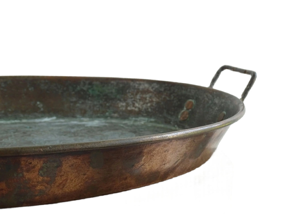 French antique copper gratin pan with two handles and tinned interior. Oval copper pan with patina.