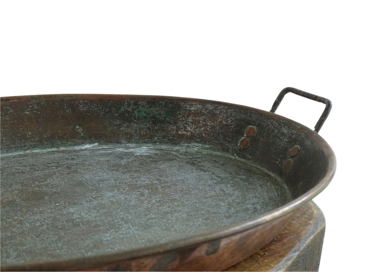 French antique copper gratin pan with two handles and tinned interior. Oval copper pan with patina.