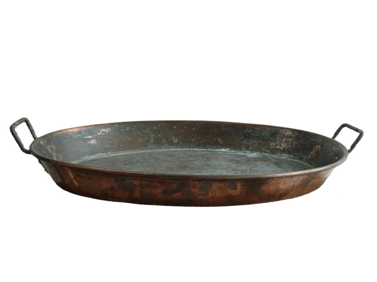 French antique copper gratin pan with two handles and tinned interior. Oval copper pan with patina.