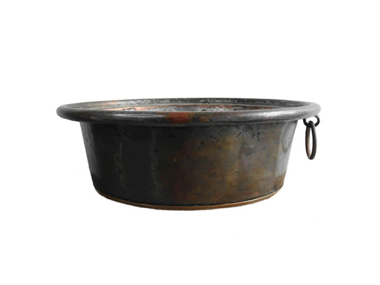 French antique copper mixing bowl with rolled top and handle. Copper bowl with timeworn appearance for a French country farmhouse kitchen.
