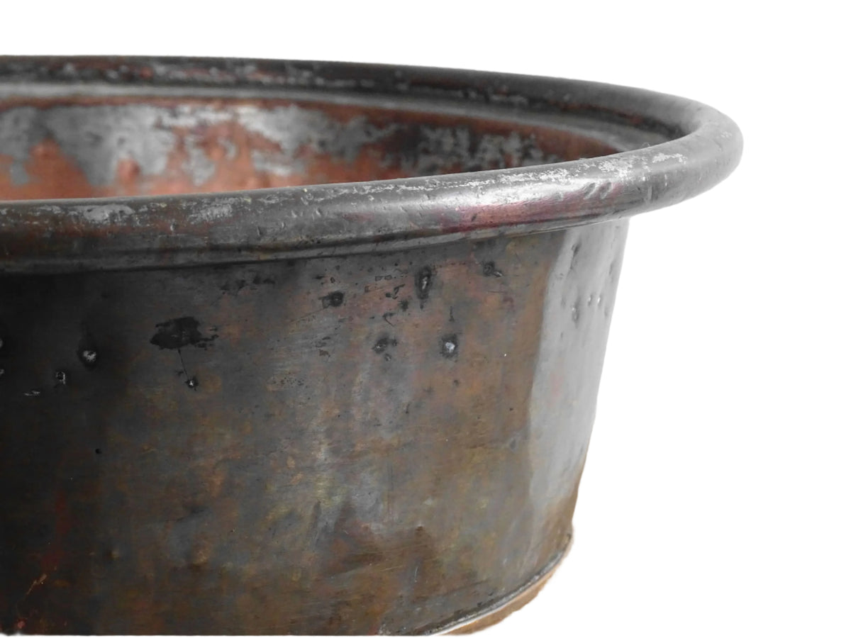 French antique copper mixing bowl with rolled top and handle. Copper bowl with timeworn appearance for a French country farmhouse kitchen.