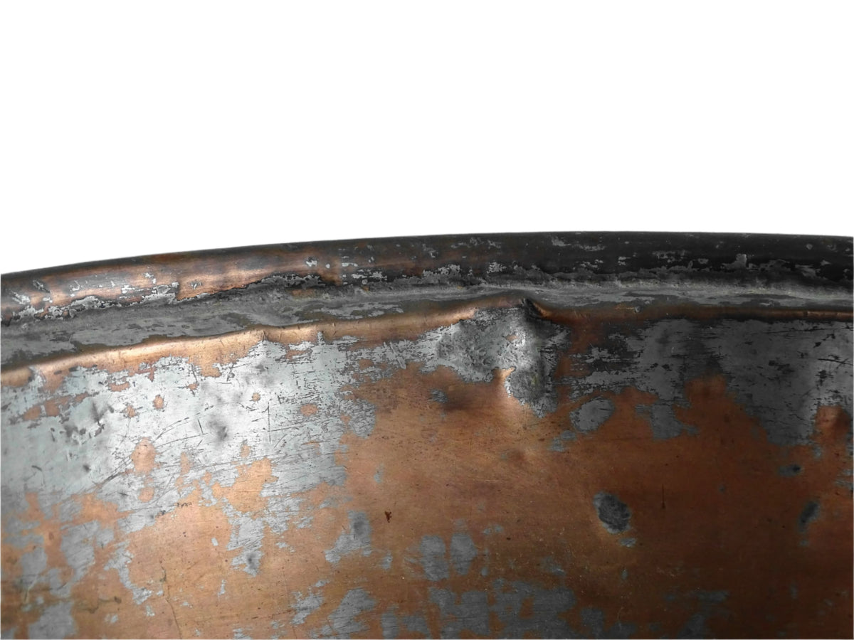 French antique copper mixing bowl with rolled top and handle. Copper bowl with timeworn appearance for a French country farmhouse kitchen.