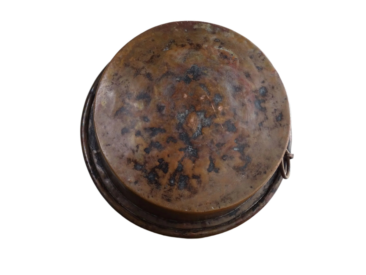 French antique copper mixing bowl with rolled top and handle. Copper bowl with timeworn appearance for a French country farmhouse kitchen.