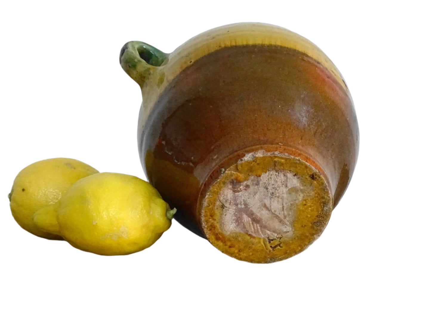 French antique gargoulette with green and yellow glaze from Provence. Antique water jug with a handle to the top and side, plus a small spout. Pottery pitcher for Provençal kitchen decor.