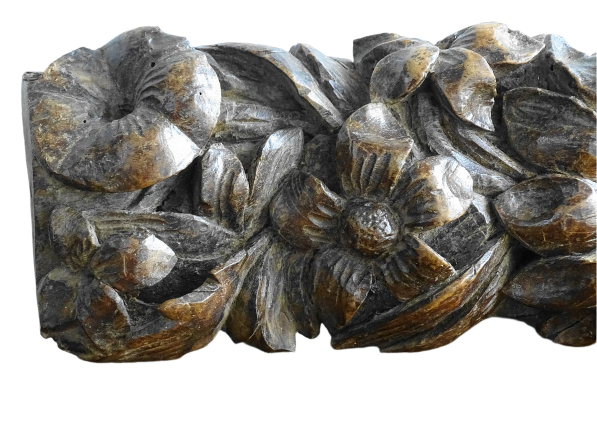 French antique wooden carving with sunflowers and roses. Old wood carving for display.