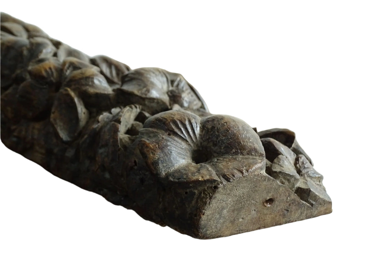 French antique wooden carving with sunflowers and roses. Old wood carving for display.