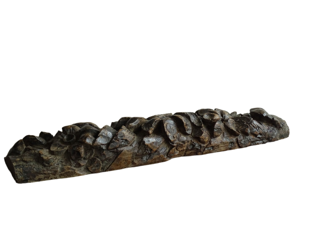French antique wooden carving with sunflowers and roses. Old wood carving for display.