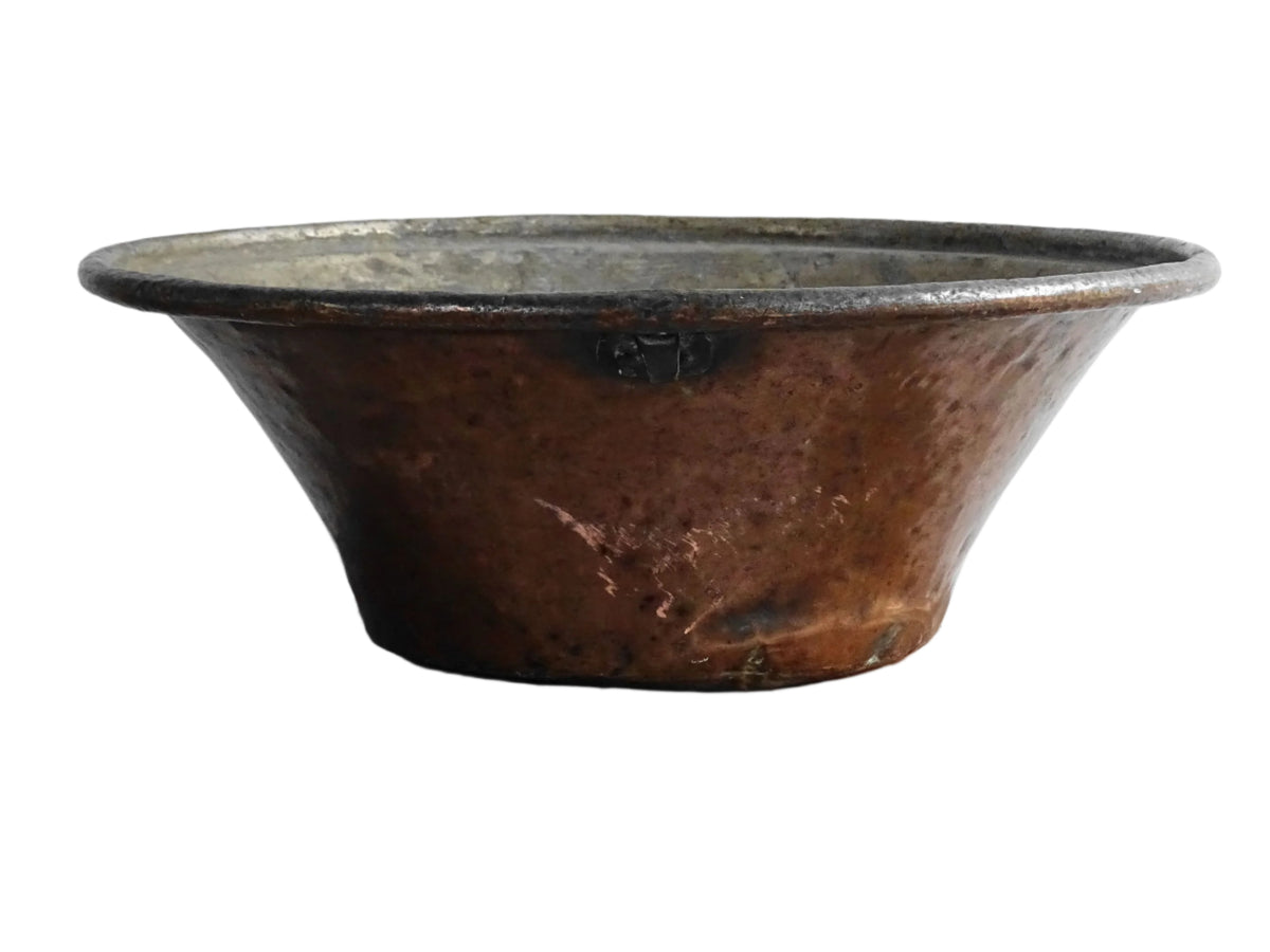 Large French antique copper bowl, it has an aged exterior with a warm patina and a tinned copper interior. It has a flared shape and substantial size. French farmhouse aesthetic decor.