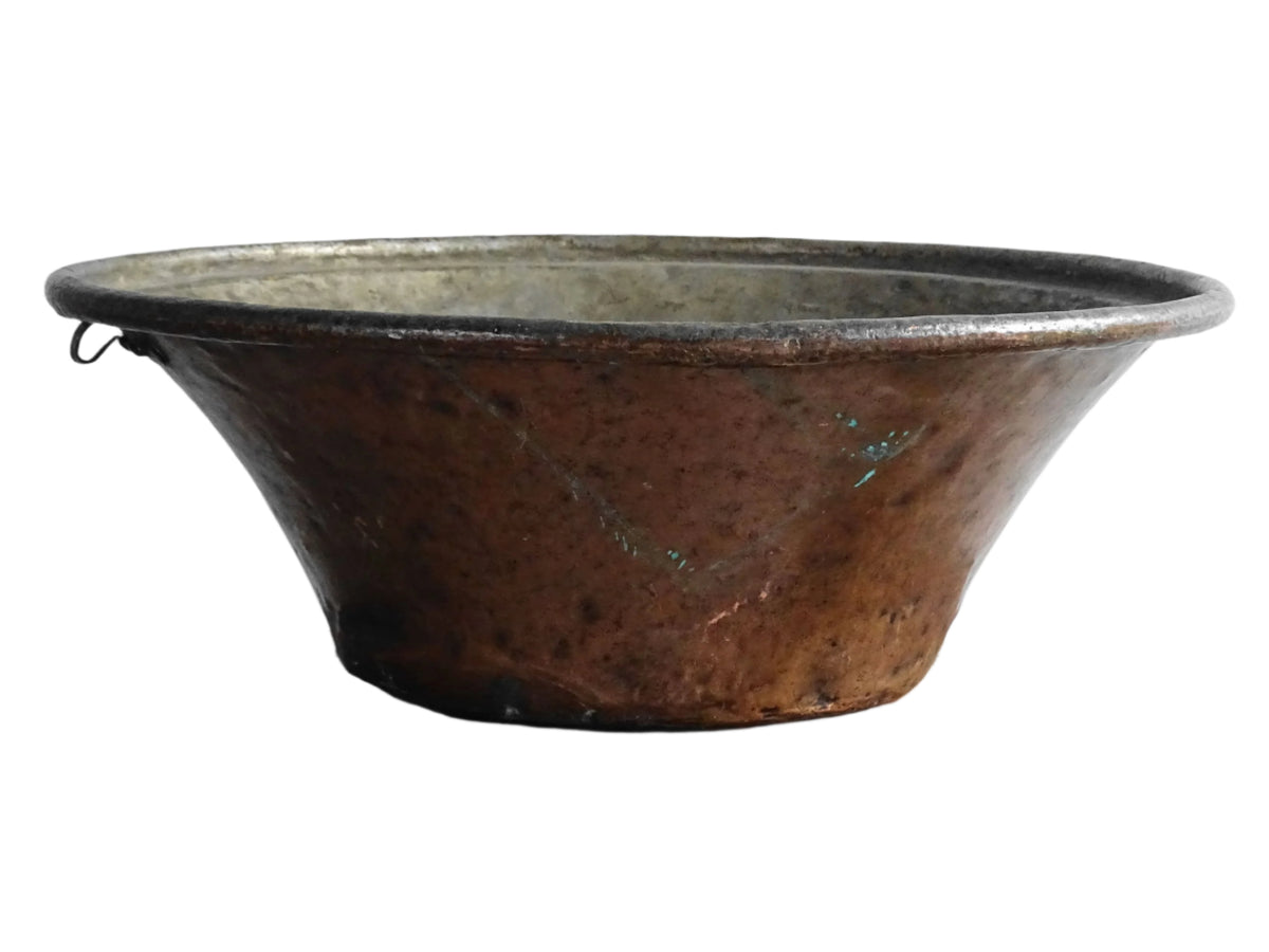 Large French antique copper bowl, it has an aged exterior with a warm patina and a tinned copper interior. It has a flared shape and substantial size. French farmhouse aesthetic decor.