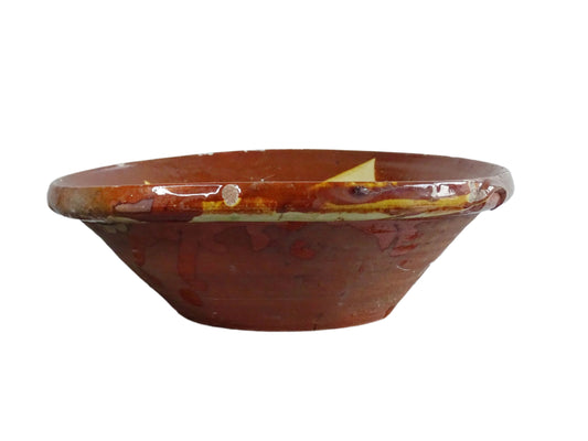 Spanish antique terracotta bowl or basin with a brown and yellow glaze to the interior. This pottery bowl has a timeworn patina.