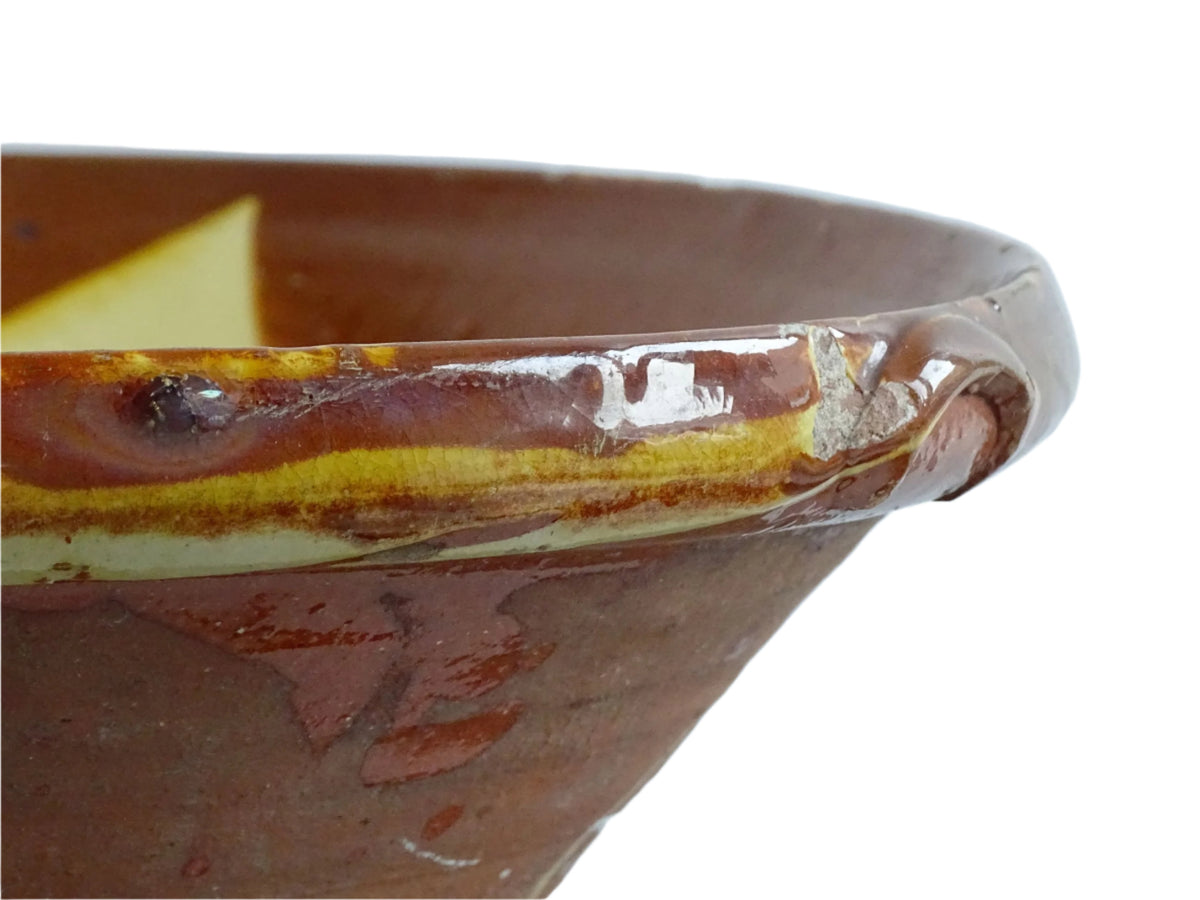 Spanish antique terracotta bowl or basin with a brown and yellow glaze to the interior. This pottery bowl has a timeworn patina.