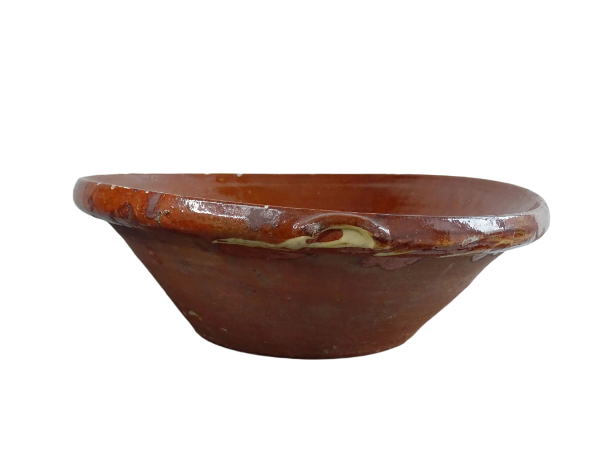 Spanish antique terracotta bowl or basin with a brown and yellow glaze to the interior. This pottery bowl has a timeworn patina.