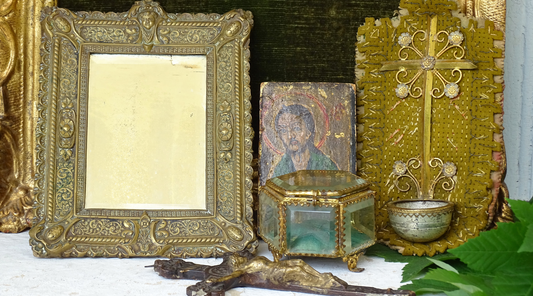 French antique and vintage trinkets including religious decor, brass mirror and glass trinket box. 