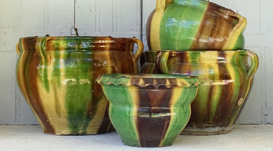 French antique Castelnaudary planters, glazed terracotta with yellow, green and brown. 