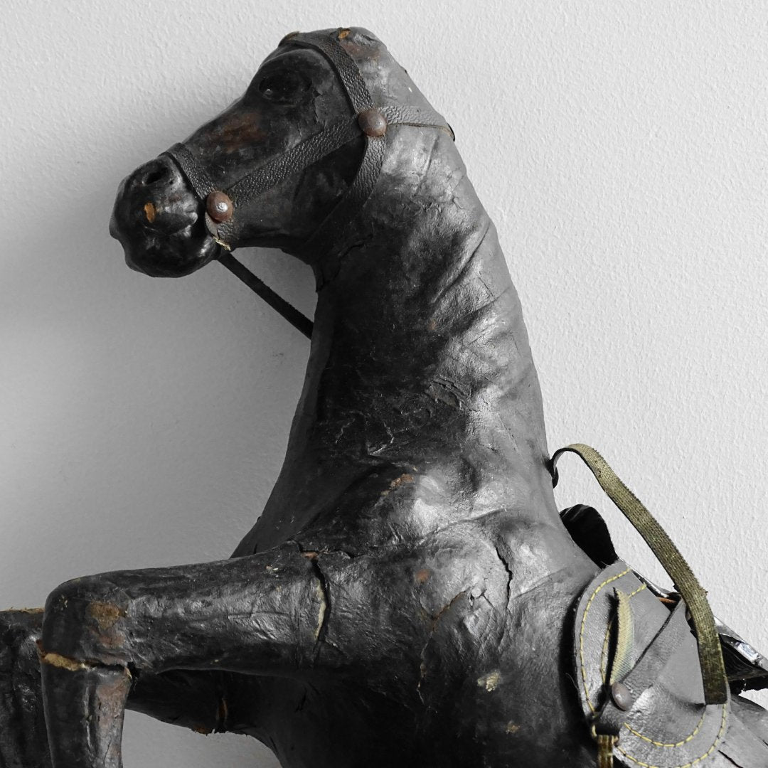 Antique leather horse figurine