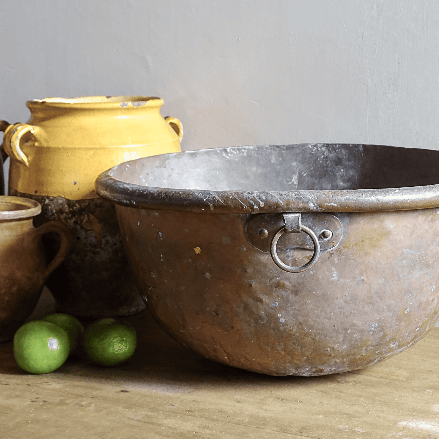 French antique copper bowl with yellow confit jar