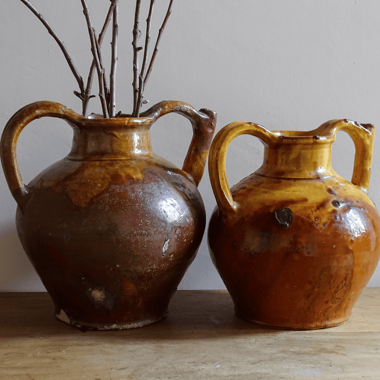 French antique pottery pitchers, glazed terracotta orjols in red and yellow