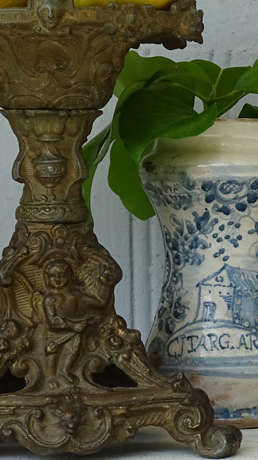 Small antique and vintage gifts: French antique cast iron candle holder, Italian antique albarello jar