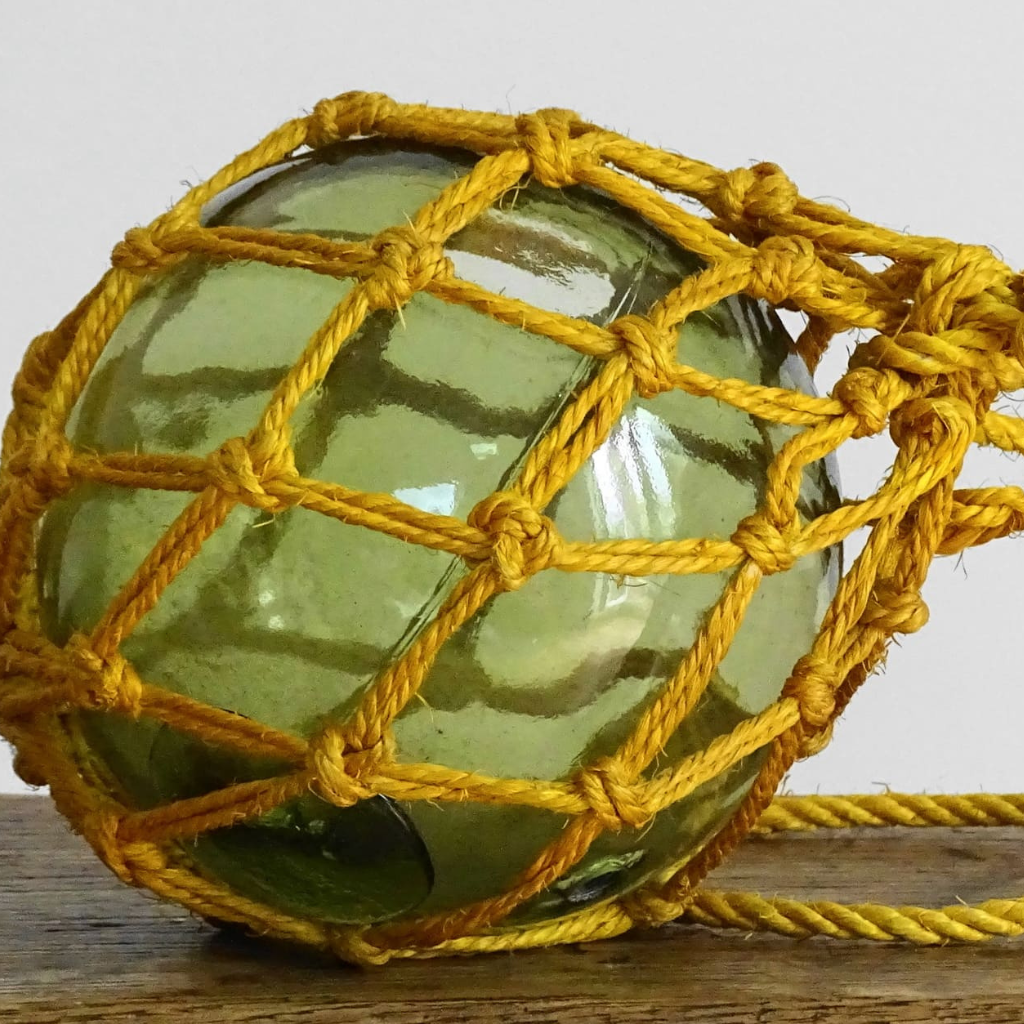 French vintage glass buoy in green glass with yellow rope