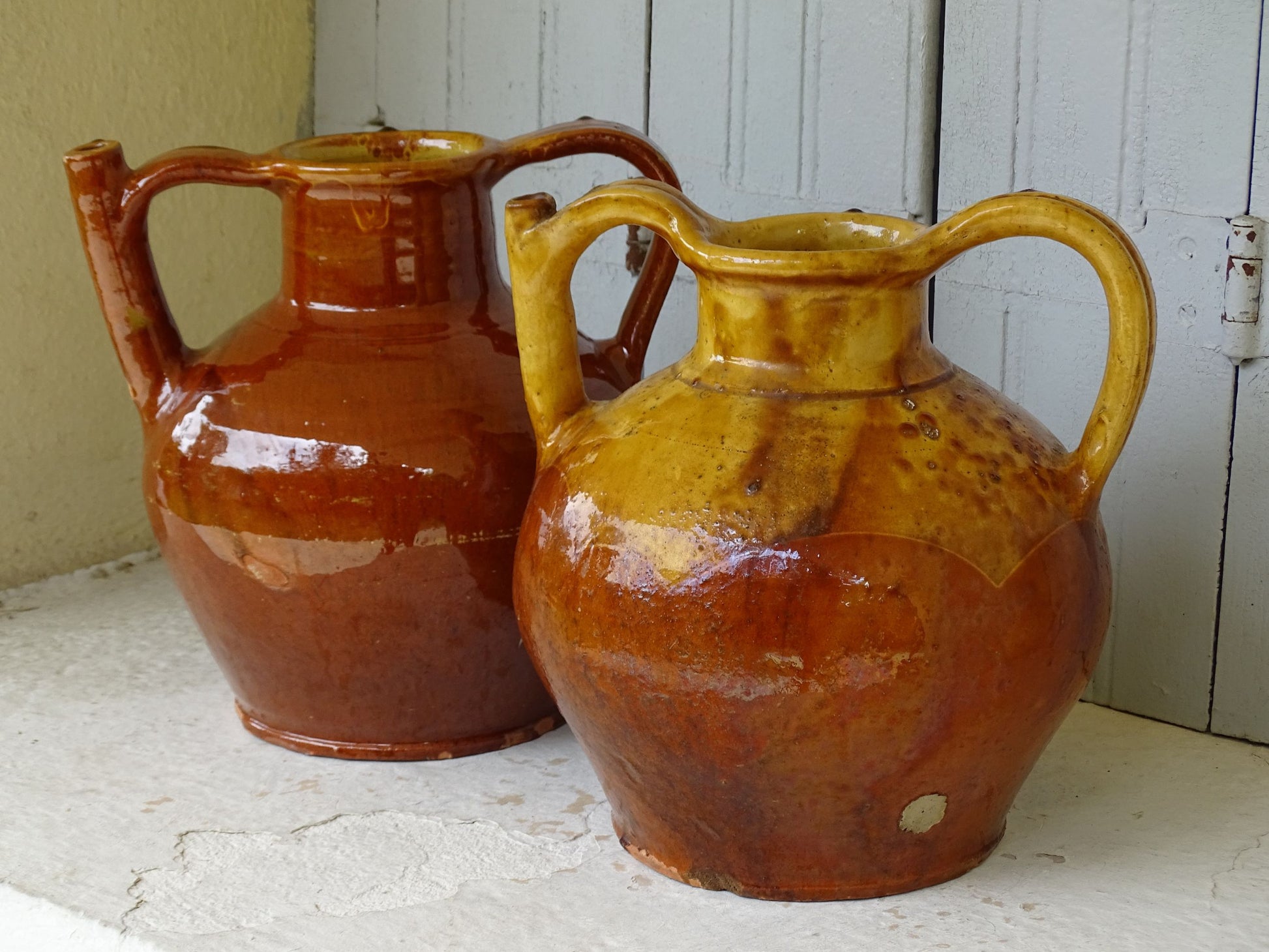 French antique pottery orjol jugs with red and yellow glazes