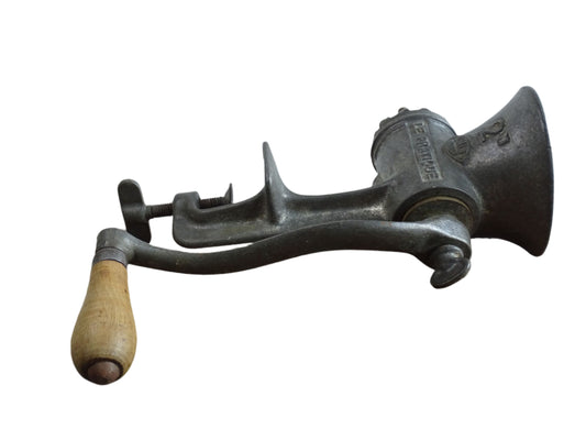 French vintage meat grinder marked 'Le Practique' with wooden handle