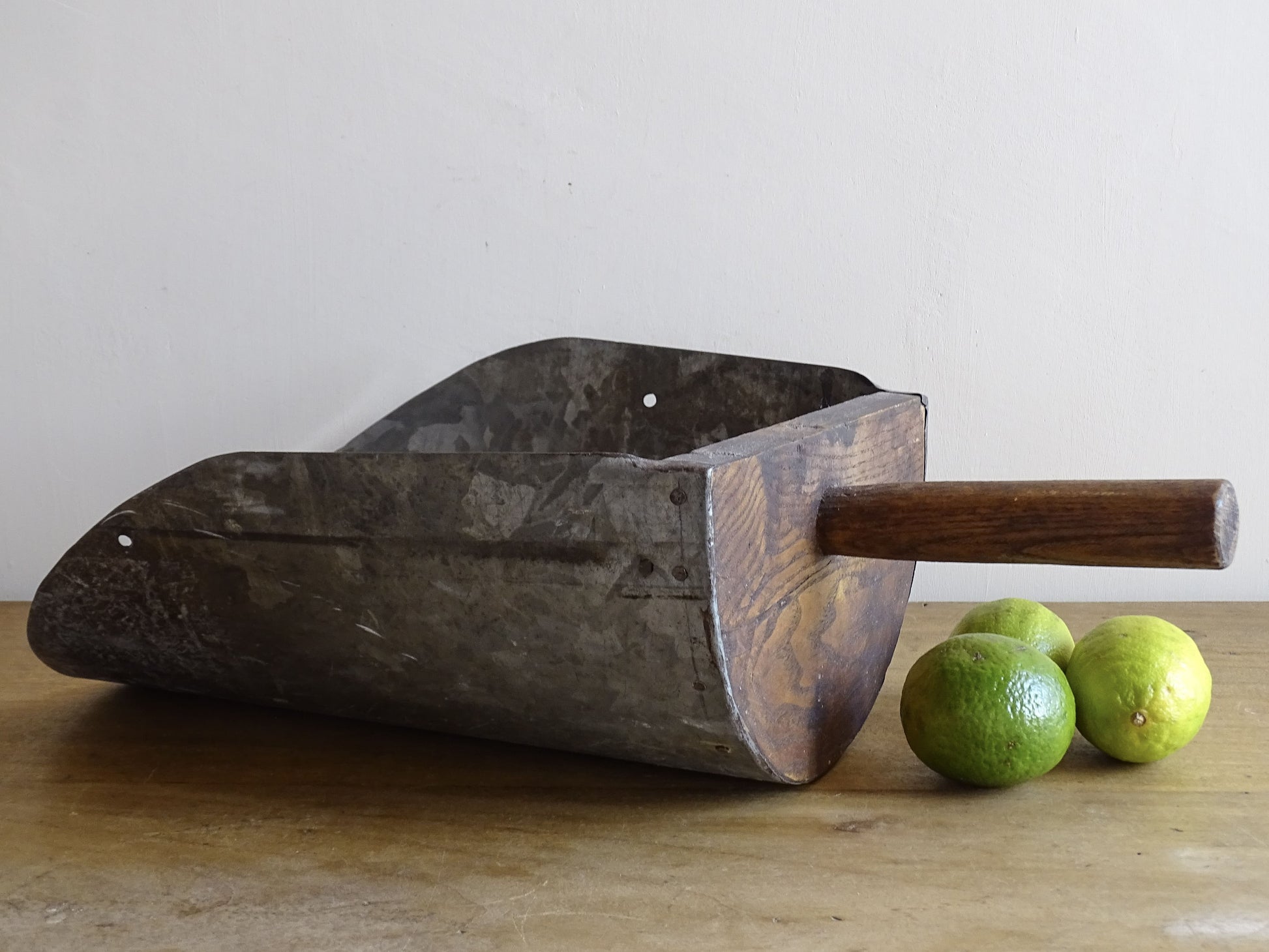 French antique grain scoop in galvanised metal with a wooden handle