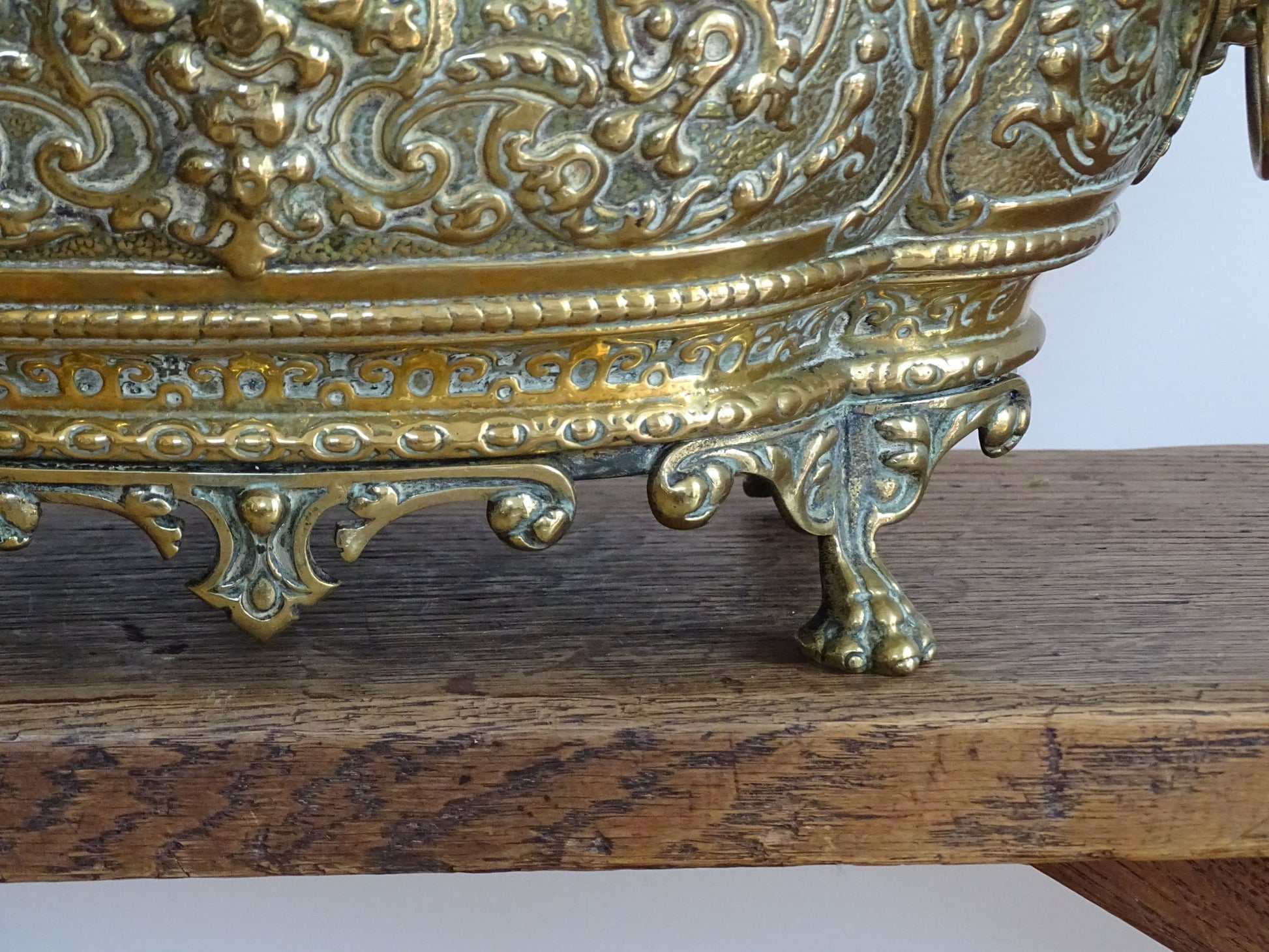 French antique brass jardinière with lion head handles and claw feet