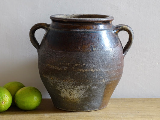 French antique earthenware vessel or confit pot in shades of brown with two handles