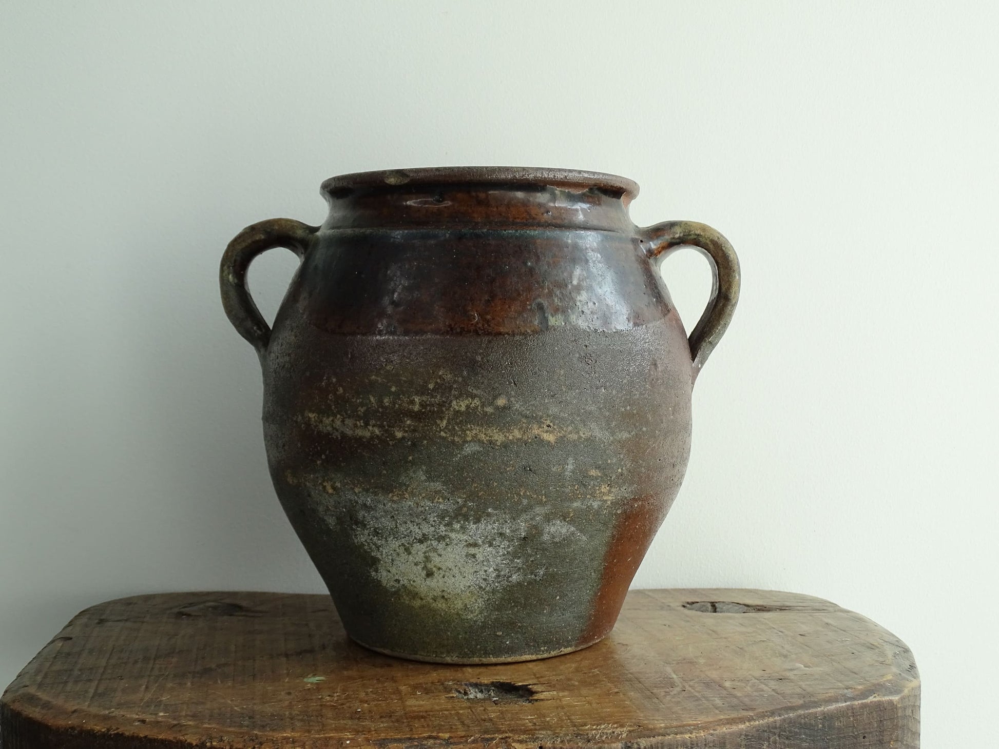 French antique earthenware vessel or confit pot in shades of brown with two handles