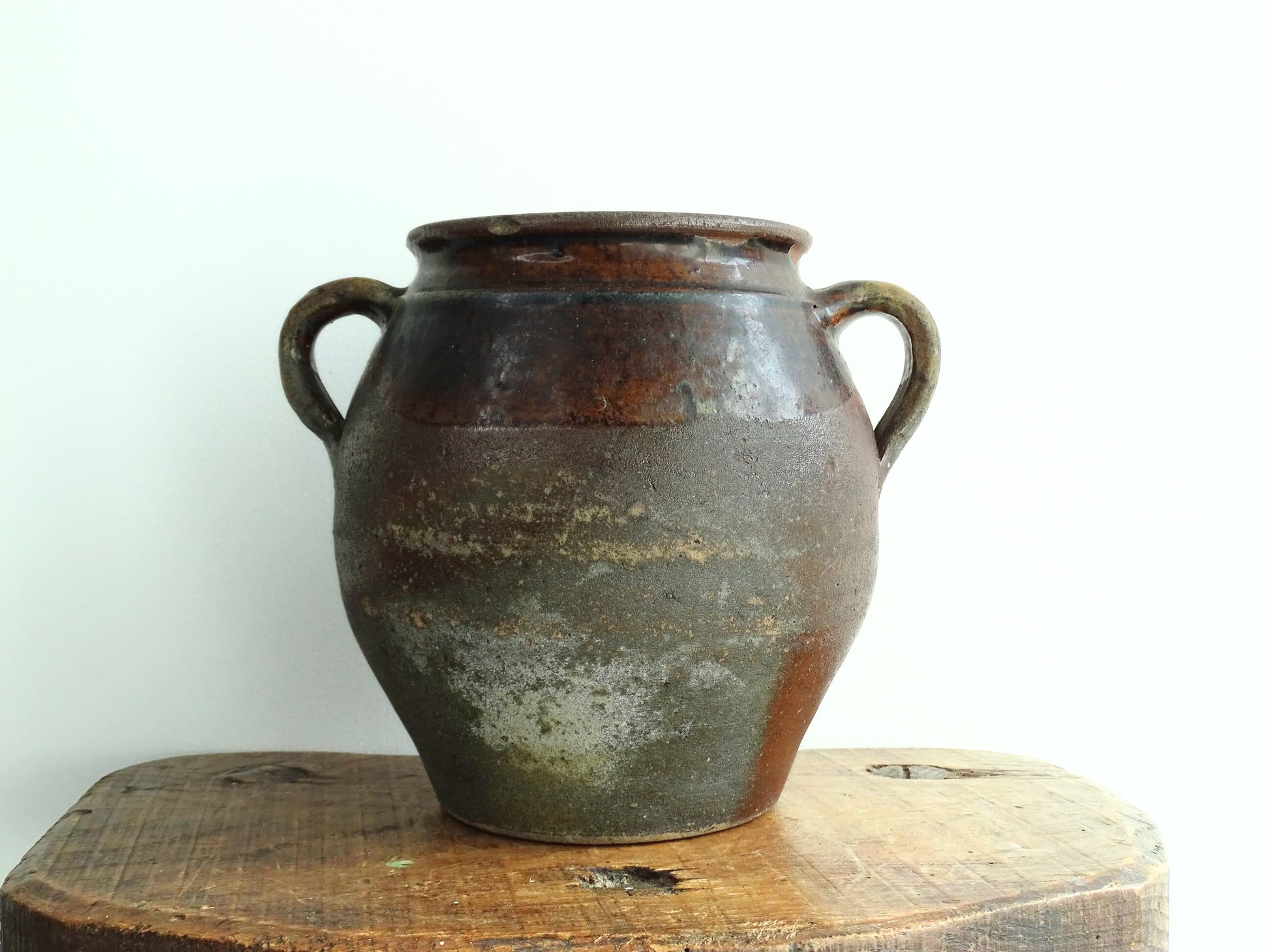 French antique earthenware vessel or confit pot in shades of brown with two handles