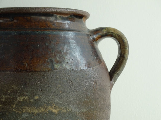 French antique earthenware vessel or confit pot in shades of brown with two handles