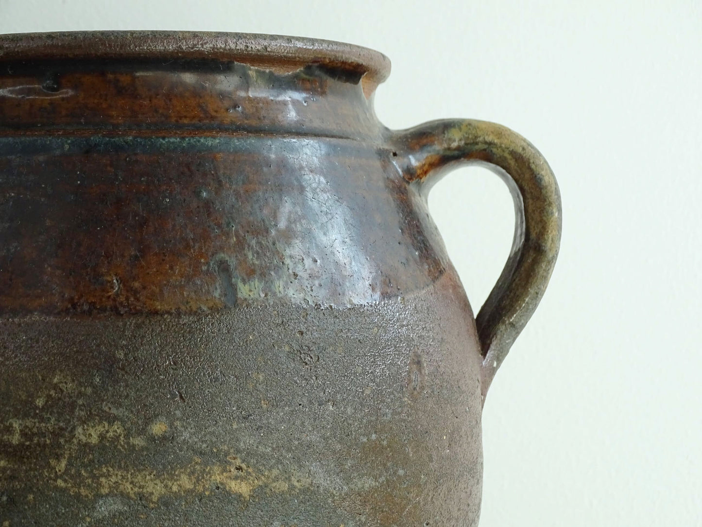 French antique earthenware vessel or confit pot in shades of brown with two handles