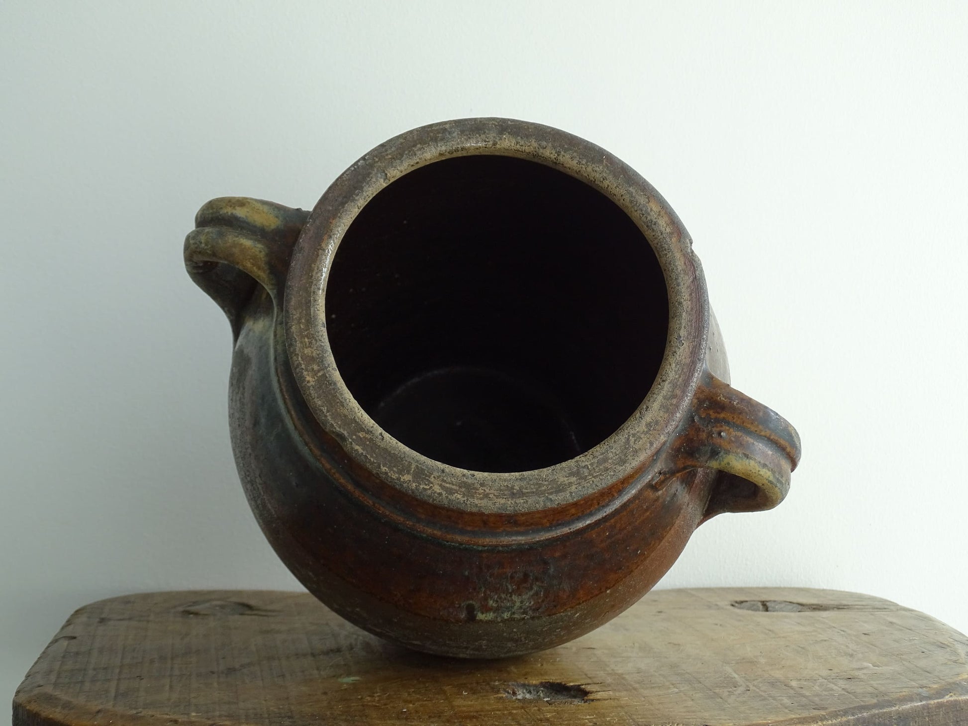 French antique earthenware vessel or confit pot in shades of brown with two handles