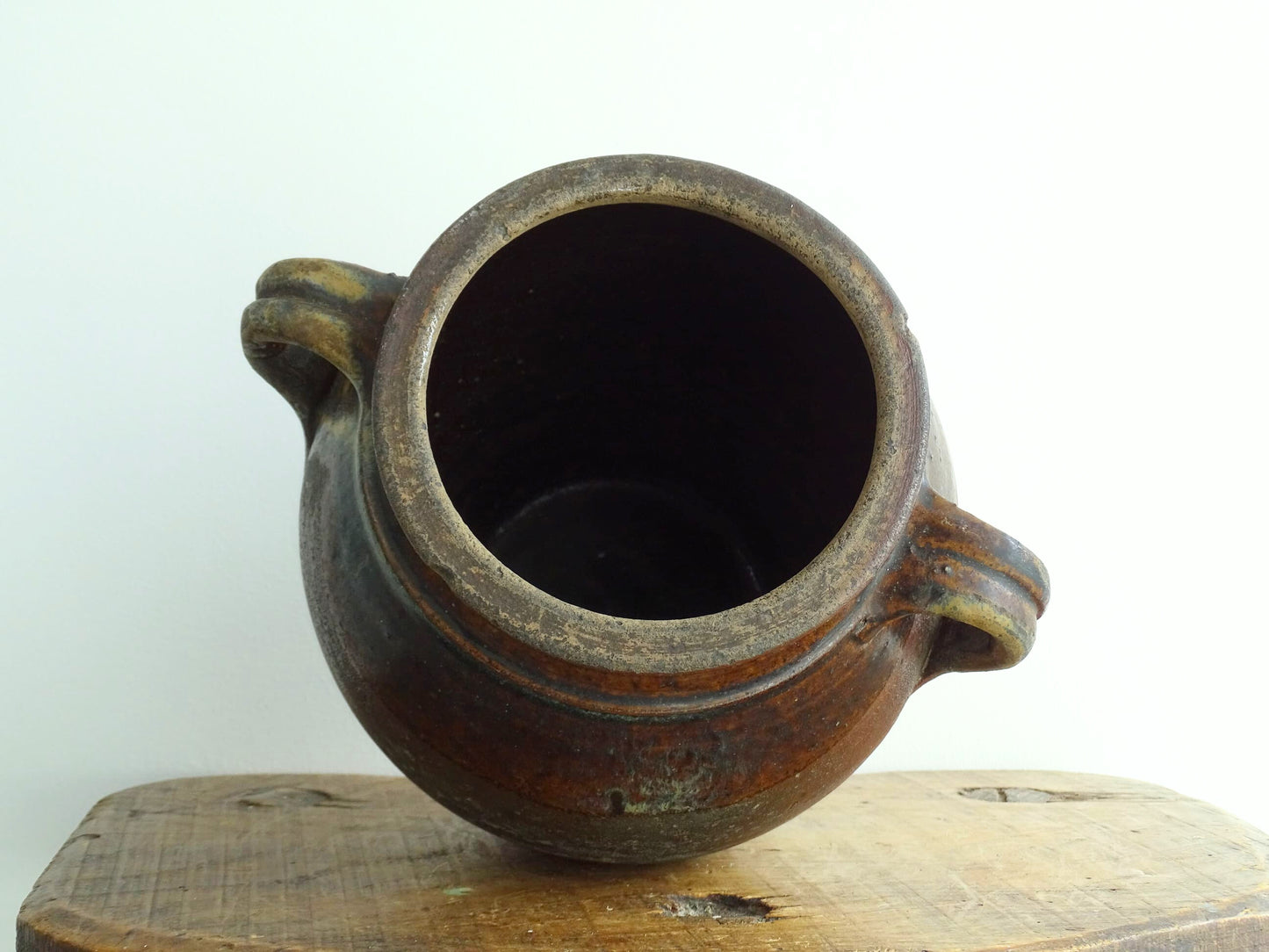 French antique earthenware vessel or confit pot in shades of brown with two handles