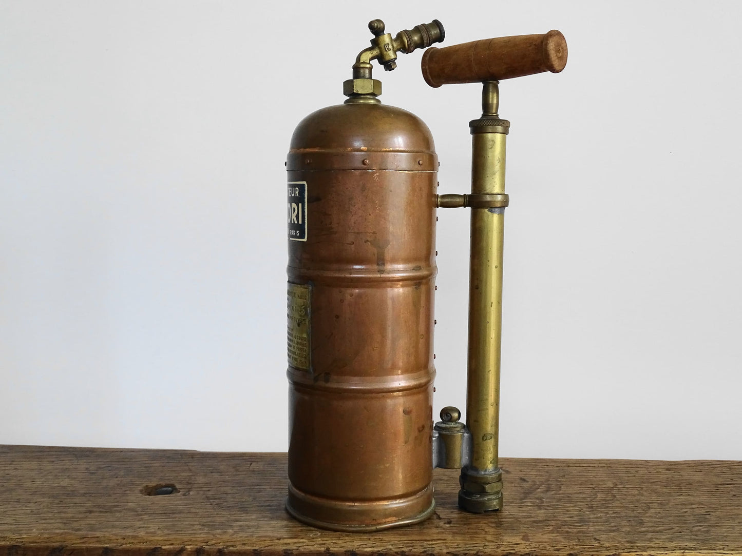 French antique copper plant sprayer or Pulvérisateur. Copper garden sprayer for industrial decorative accent.