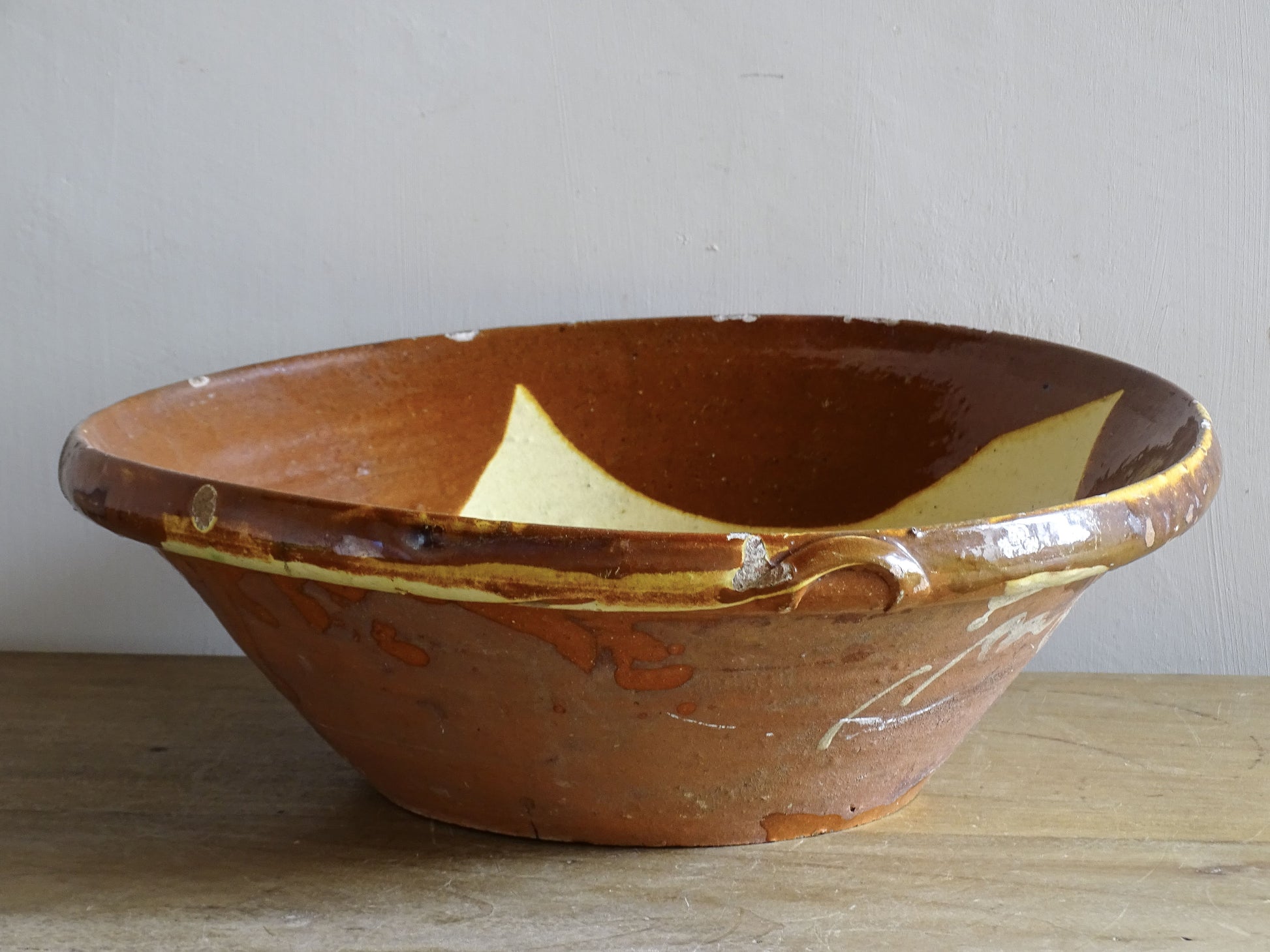 Rustic Spanish antique earthenware bowl with orange glaze 