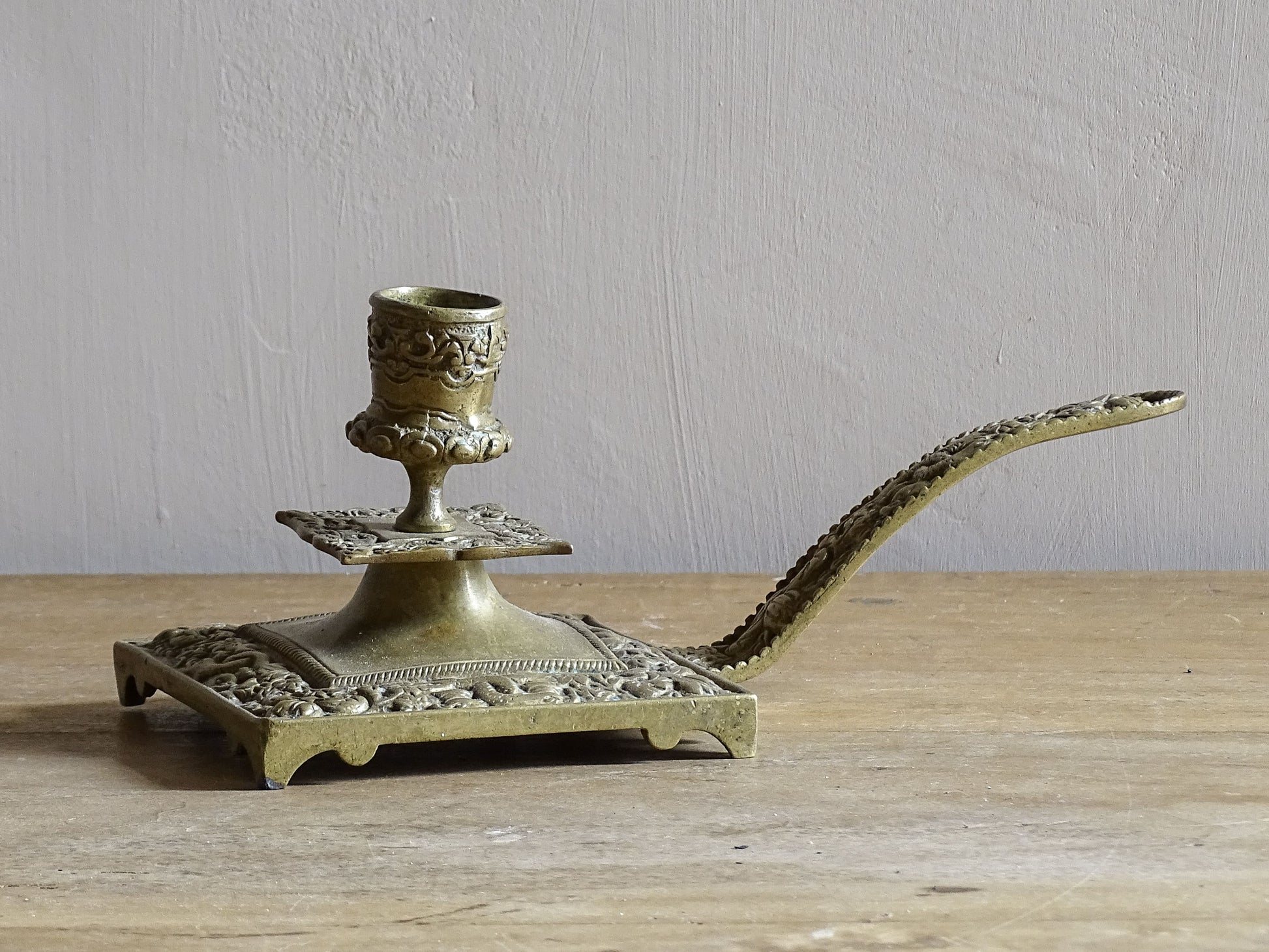 French antique brass candle holder or chamberstick with handle.