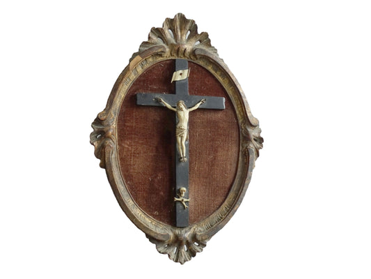 French antique framed crucifix with a gold wood oval frame and a brown velvet background