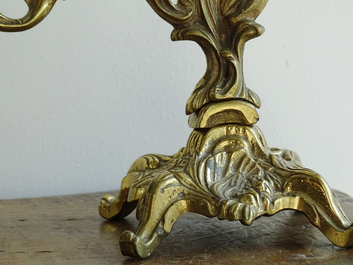 Pair of French antique brass candelabras in a rococo style. Early 20th century antique candelabras with space for two tapered candlesticks. Brass candle holders for dining table decor or living room decor.